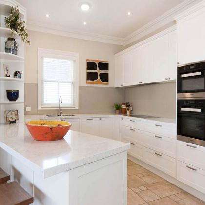 White curved kitchen cabinet